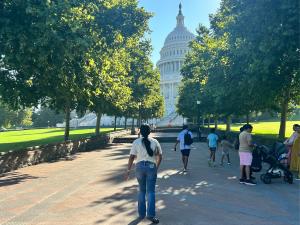 A youth from Sunny Glen Children's Home, who participated in the Do the Write Thing program for her essay on youth violence, walks up a tree-lined pathway toward the U.S. Capitol dome during a trip to Washington, D.C.