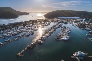 Aerial view of Skyline Marine Center marina basin in Anacortes, Washington, with wet slips, boat storage facilities, and access to the San Juan Islands.