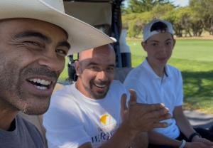 Village of Warriors Founder Anthony Baker celebrates the nonprofit's inaugural golf tournament with volunteers and golfers.