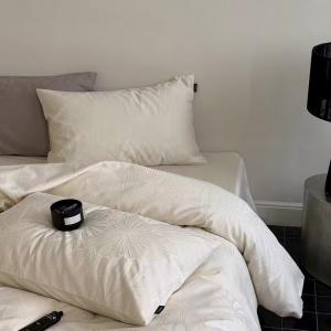 RUHO-Living cream jacquard bedding set with a botanical woven pattern in a styled bedroom