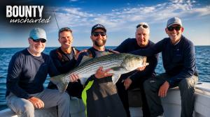 Jeff Ragovin, Michael A. Cuomo, Don Garber, Ofer Vicus and Rob Mitchell hold a massive striped bass aboard Bounty Uncharted off Montauk.