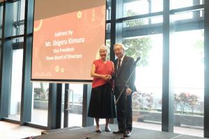 Vice-Chairman of Kowa Board of Directors, Mr. Shigeru Kimura, shakes hands with HST Medical co-founder Ms Simone Tan at the acquisition signing ceremony