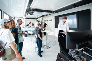 Pulse Drop Deck hospitality trailer interior hosting guests at Porsche activation | The Clear Idea