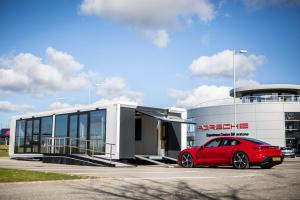 Pulse Drop Deck hospitality trailer beside a Porsche Taycan at Silverstone | The Clear Idea