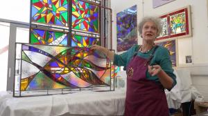 An artist shows her glass work
