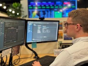Engineer using computer software to model and optimize advanced materials for aerospace applications.