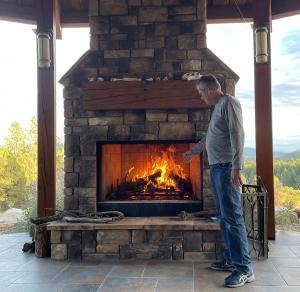 My brother-in-law checking out the fire after our rocket-rat excitement. Staging a fireplace may look pretty, but it also attracts rodents who like to make their nests in confined spaces