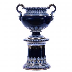 Historical two-piece flowerpot and pedestal commonly referred to as the Dewey Jardiniere by the Wheeling Pottery Company and carrying the mark of the firm. Estimate: $4,000-$6,000