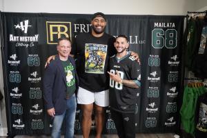 Brian Fritz (left) with Jordan Mailata (center) and Art History 101's Jay Pross (right) at the unveiling of the "Man From Down Under" T-shirt at Art History 101 on July 18 in Philadelphia.
