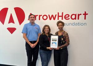 Executive Director Jernine McBride and Development Director Thomas Franke presenting the Ronald McDonald House Inland Empire Golden Spatula Award to Arrowhead Credit Union and the ArrowHeart Foundation.