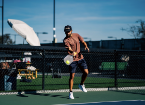 A man playing pickleball