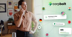 Founder abroad on a phone call beside CORPBOLT graphics showing country flags routing to a US flag, with Wyoming LLC filed and Federal EIN secured labels.