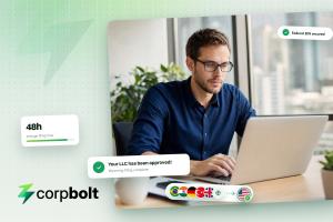 Founder working on a laptop beside CORPBOLT notifications reading Your LLC has been approved, Wyoming filing complete, and Federal EIN secured.
