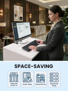 Hotel staff using the PERIBOARD-513 III wired keyboard at a check-in workstation, with icons showing space-saving applications for hotel self check-in, kiosks, industrial use, and rack/KVM setups.