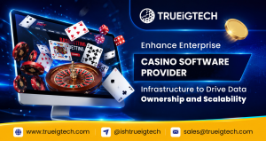 It's a banner titled TRUEiGTECH Enhances Enterprise Casino Software Provider Infrastructure to Drive Data Ownership and Scalability, featuring a desktop monitor displaying an online casino interface with a roulette wheel, playing cards, casino chips, etc.