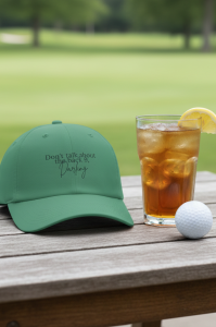 Dark green hat that says Don’t talk about the back nine VolleyBird hat