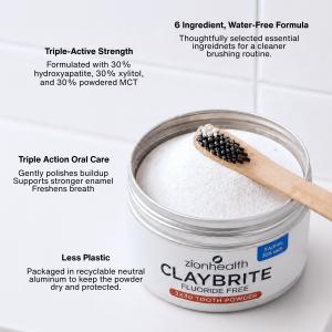Open container of Zion Health CLAYBRITE® Tooth Powder with a bamboo toothbrush and text describing its triple-active formula, oral care benefits, and recyclable aluminum packaging.