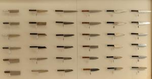Wall display of Japanese kitchen knives inside MUSASHI JAPAN France Blue Store in Paris