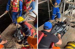 INMARVENCO technicians in safety gear prepare a CHASING X industrial ROV on a work platform for a Caroní River pile inspection.