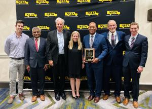 John Elliott Jr. with fellow colleagues celebrating his Golden Merit Award