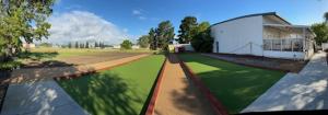 Outdoor bocce ball courts at Hope Services in Gilroy, California for accessible recreation for people with developmental disabilities.