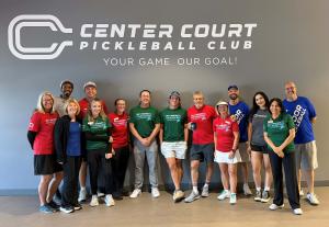Employees and leadership team celebrate opening of new club