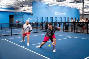 Players on a new court at Shea location