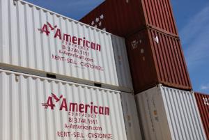 multiple shipping containers stacked with the A American Logo on the sides
