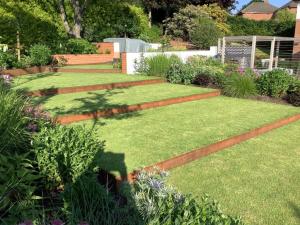 A previous entry in Buy Metal Online's Made With Metal content. The image features a landscaped garden, with Corten steel edging on a multi-terraced lawn.