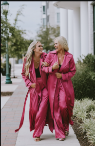 Sarah Riggs Vanderford (left) and her sister, Mel Carr (right), share a joyful reunion decades after being separated through adoption and reconnecting through AncestryDNA