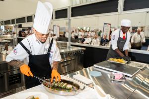 Chef Yudel Torres, CEC, CEPC plates a dish in the ACF Chef of the Year competition