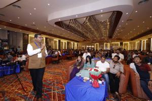 Attendee asking a question to a speaker during the interactive session at HSIM Digital Business Summit 2026