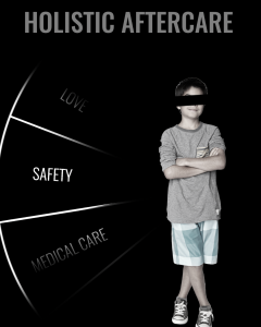 A young boy with his arms crossed standing by the word SAFETY.