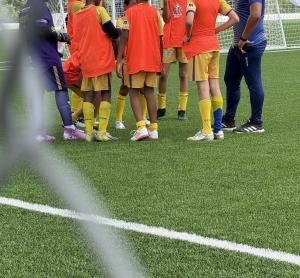 Boys participating in a soccer match.