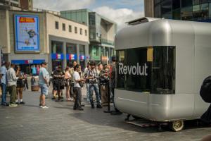 Nomad Luxe mobile pop up shop branded for Revolut on a Birmingham street with people queuing | The Clear Idea