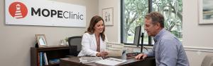 MOPE Clinic provider in Metairie reviewing peptide therapy labs and treatment options with a patient