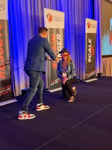 Sandy Wardenburg Waggett of MSW Interactive Designs on stage receiving the Ninja Hack Award at the Seven Figure Agency Intensive