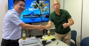 KingPo and Techno Science Japan representatives confirming an authorized distribution partnership
