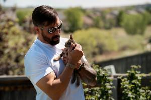 Chris Messina holding his kitten, an Orange Tabby