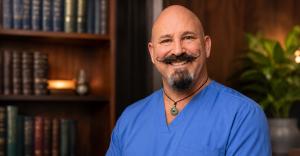 Dr. William Deihl of Doc Hypnosis in blue scrubs, offering personalized hypnotherapy for unwanted habits, cravings, stress, and sleep concerns across Greater Phoenix.
