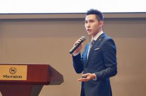 Hideaki Kuo speaking about SBA financing and business growth at the Cybercon AI event.