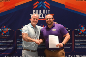 Lance Bachmann shaking hands with Robert “Rob” Bonelli