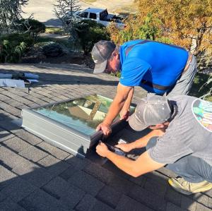 Whirlwind Roofing installing a skylight