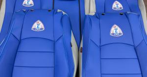 Blue EKR custom-fit car seat covers featuring a commemorative patriotic embroidery design