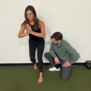 A patient of Elevated Sport & Spine performing ankle exercises for their health.
