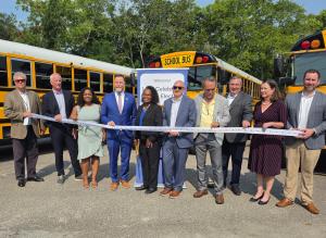 Ribbon cutting with Representative Aaron Bean (fourth from the left), along with Paul Talarico, SVP of Operations, and Erika Harding, General Manager.