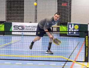 Ukrainian combat veteran Mykola Zarytskyi, who plays with a prosthetic leg, on an indoor pickleball court at the First Ukrainian Veterans Pickleball Championship in Kyiv, 2026.