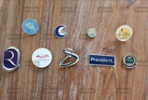 Branded lapel pins, lanyards and event T-shirts for corporate trade shows.