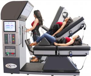 In the image is the DRX9000 spinal decompression table, showing how it tilts. On the left hand side of the image is the DRX9000 tower, on the right is the DRX9000 bed that the patient lays on.