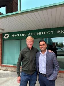 Chris Naylor and Tushar Negi, Principal Architect, standing in front of Naylor Architect Inc. signage in Toronto.